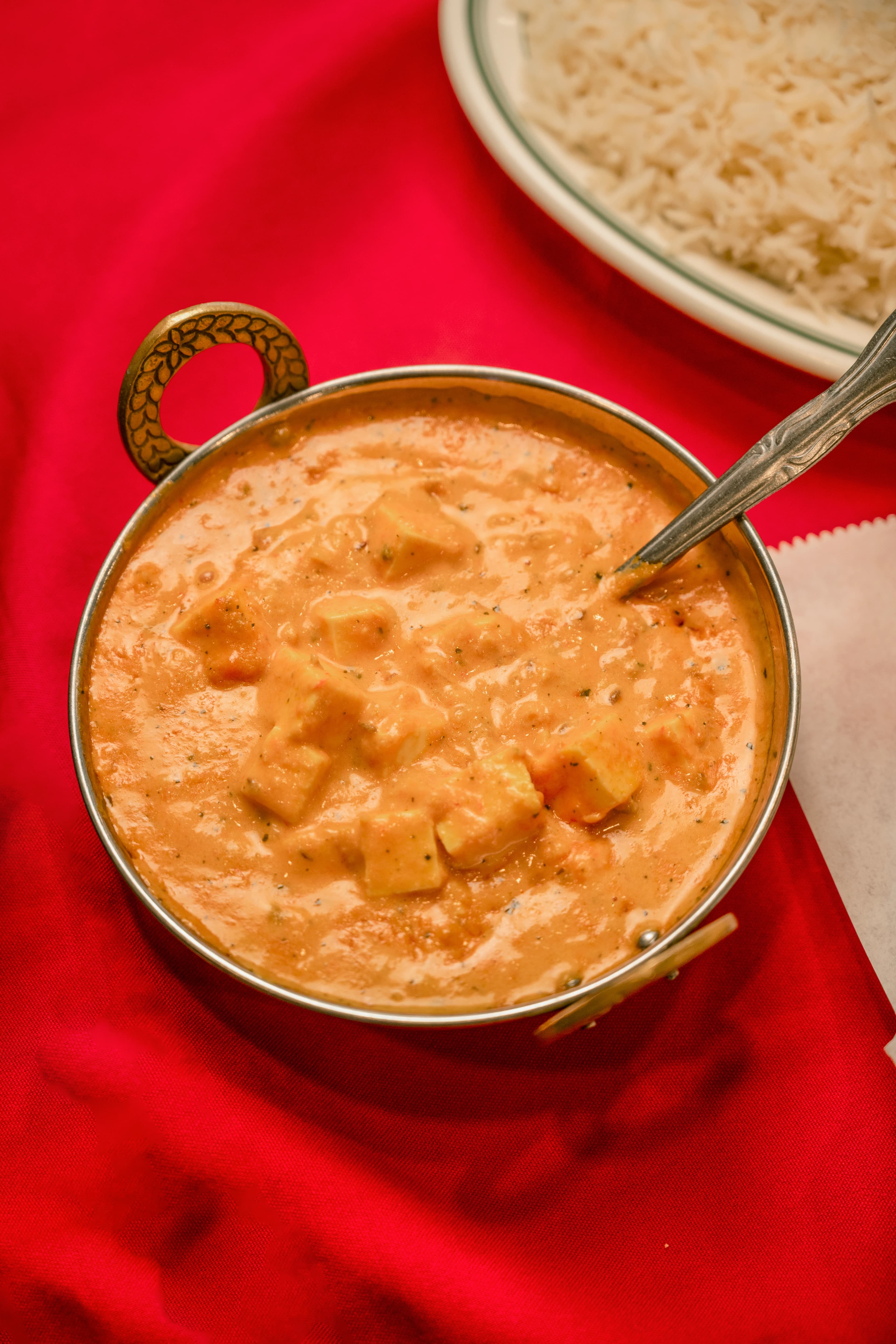Paneer butter masala in a traditional bowl